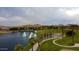 Aerial view of lakefront community with walking paths and lush landscaping at 17427 W Rock Wren Ct, Goodyear, AZ 85338