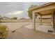 Spacious backyard with covered patio and desert landscaping at 17427 W Rock Wren Ct, Goodyear, AZ 85338