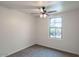 Spacious bedroom featuring a ceiling fan and large window at 17427 W Rock Wren Ct, Goodyear, AZ 85338