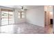 Bright dining area with tile flooring and access to patio at 17427 W Rock Wren Ct, Goodyear, AZ 85338