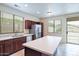 Island kitchen with stainless steel appliances and wood cabinets at 17427 W Rock Wren Ct, Goodyear, AZ 85338