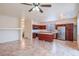 Spacious kitchen with island, stainless steel appliances, and wood cabinets at 17427 W Rock Wren Ct, Goodyear, AZ 85338