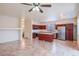 Kitchen with island, stainless steel appliances, and wood cabinets at 17427 W Rock Wren Ct, Goodyear, AZ 85338