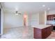 Open concept kitchen and dining area with tile flooring at 17427 W Rock Wren Ct, Goodyear, AZ 85338