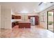 Open kitchen and dining area with sliding door to patio at 17427 W Rock Wren Ct, Goodyear, AZ 85338