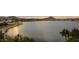 Panoramic view of a lake with mountains in the background at 17427 W Rock Wren Ct, Goodyear, AZ 85338