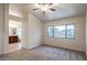 Spacious main bedroom with carpet flooring and ensuite bathroom at 17427 W Rock Wren Ct, Goodyear, AZ 85338