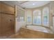 Spa-like bathroom with soaking tub and shower at 18009 W Denton Ave, Litchfield Park, AZ 85340