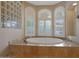 Relaxing bathroom with large tub and separate shower at 18009 W Denton Ave, Litchfield Park, AZ 85340