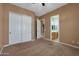 Bedroom with double door closet and en-suite bathroom at 18009 W Denton Ave, Litchfield Park, AZ 85340