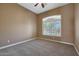 Bright bedroom with window shutters and carpet flooring at 18009 W Denton Ave, Litchfield Park, AZ 85340