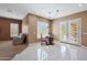 Charming breakfast nook with a wooden table and French doors at 18009 W Denton Ave, Litchfield Park, AZ 85340