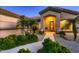 Front entry with walkway, landscaping, and large urns at 18009 W Denton Ave, Litchfield Park, AZ 85340