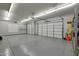 Large garage with epoxy floor and storage shelving at 18009 W Denton Ave, Litchfield Park, AZ 85340