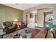 Bright and airy living room with a view of the entryway at 18009 W Denton Ave, Litchfield Park, AZ 85340