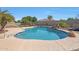 Inviting swimming pool with waterfall feature at 18009 W Denton Ave, Litchfield Park, AZ 85340