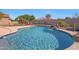 Relaxing swimming pool with a waterfall feature at 18009 W Denton Ave, Litchfield Park, AZ 85340