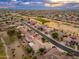 Aerial view of neighborhood with mountain views in the background at 18135 N Saddle Ridge Dr, Surprise, AZ 85374