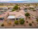 Aerial view showcasing house and neighborhood at 18135 N Saddle Ridge Dr, Surprise, AZ 85374