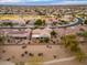 Aerial view of house and surrounding neighborhood at 18135 N Saddle Ridge Dr, Surprise, AZ 85374