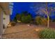 Landscaped backyard with gravel and desert plants at 18135 N Saddle Ridge Dr, Surprise, AZ 85374