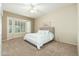 Bright bedroom with window and ceiling fan at 18135 N Saddle Ridge Dr, Surprise, AZ 85374