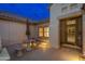 Charming courtyard with seating area, illuminated at night at 18135 N Saddle Ridge Dr, Surprise, AZ 85374