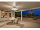 Covered patio with seating area and backyard view at 18135 N Saddle Ridge Dr, Surprise, AZ 85374