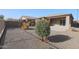 Backyard view of home with gravel and trees at 18171 W Glenhaven Dr, Goodyear, AZ 85338