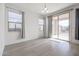 Empty dining area with sliding glass doors leading to the backyard at 18171 W Glenhaven Dr, Goodyear, AZ 85338