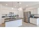 Modern kitchen with white cabinets, granite countertops, and stainless steel appliances at 18171 W Glenhaven Dr, Goodyear, AZ 85338