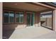 Covered patio with sliding glass door and window at 18171 W Glenhaven Dr, Goodyear, AZ 85338