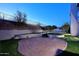 Brick patio and artificial turf backyard with fire pit at 18258 N 15Th Pl, Phoenix, AZ 85022