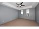 Cozy bedroom with ceiling fan and neutral decor at 18258 N 15Th Pl, Phoenix, AZ 85022