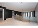 Modern hallway with glass railings and neutral carpeting at 18258 N 15Th Pl, Phoenix, AZ 85022