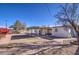 Large backyard with covered patio, gravel, and brick pathways at 1918 W Colter St, Phoenix, AZ 85015