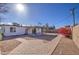 Backyard with covered patio, gravel, and brick pathways at 1918 W Colter St, Phoenix, AZ 85015