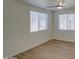 Spacious bedroom with wood-look floors and window blinds at 1918 W Colter St, Phoenix, AZ 85015