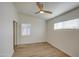 Well-lit bedroom featuring wood-look flooring and ceiling fan at 1918 W Colter St, Phoenix, AZ 85015