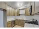 Updated kitchen featuring wood cabinets and quartz countertops at 1918 W Colter St, Phoenix, AZ 85015