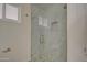 Walk-in shower with marble tile and glass enclosure at 1918 W Colter St, Phoenix, AZ 85015