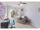 Bright bedroom with window, comfy chair, and workspace at 19601 N 7Th St # 1042, Phoenix, AZ 85024