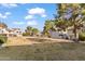 Spacious community lawn with mature trees and multiple residential buildings at 19601 N 7Th St # 1042, Phoenix, AZ 85024