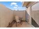 Private patio with small table and chair, ideal for relaxing at 19601 N 7Th St # 1042, Phoenix, AZ 85024