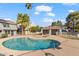 Community pool with surrounding patio and lounge chairs at 19601 N 7Th St # 1042, Phoenix, AZ 85024