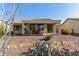 Covered patio and desert landscaping at 21532 N 262Nd Ln, Buckeye, AZ 85396