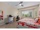 Bedroom with large window and ceiling fan at 21532 N 262Nd Ln, Buckeye, AZ 85396