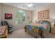 Guest bedroom with large window and ceiling fan at 21532 N 262Nd Ln, Buckeye, AZ 85396