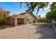 Spacious backyard with grassy lawn, patio, and covered sitting area at 21918 N 66Th Ln, Glendale, AZ 85310