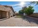 Large backyard with grassy area, patio, and storage shed at 21918 N 66Th Ln, Glendale, AZ 85310